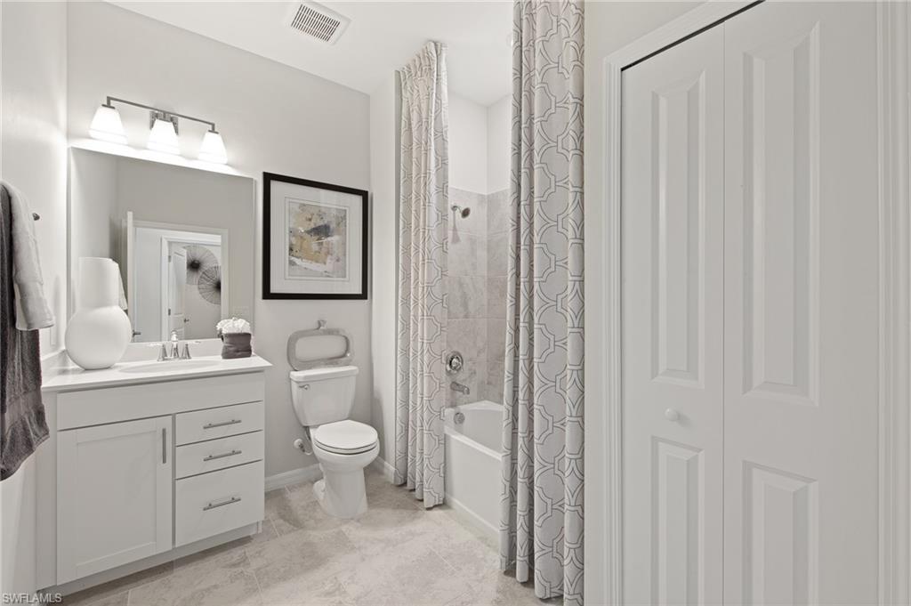 6008 Ellerston Way Avenue, Unit 1021 Immokalee, FL 34142 - Photo 29 of 50 Bathroom featuring vanity, a closet, shower / bath combo, and light tile patterned floors