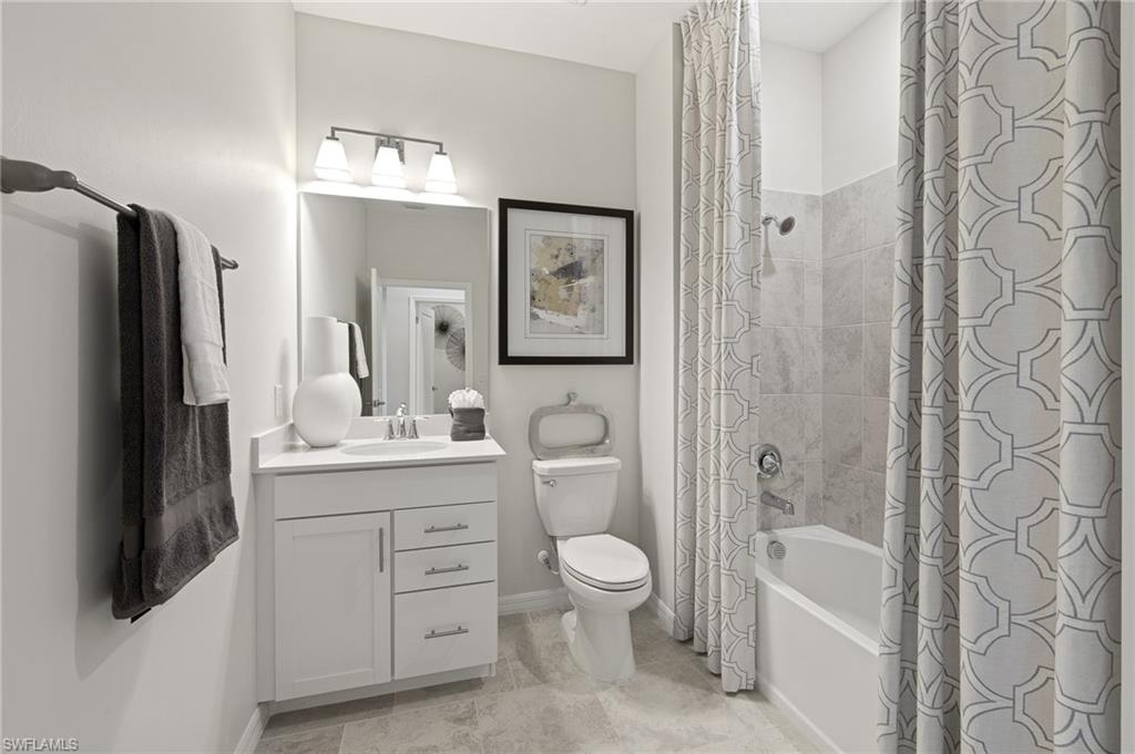 6008 Ellerston Way Avenue, Unit 1021 Immokalee, FL 34142 - Photo 30 of 50 Full bathroom featuring shower / bath combination with curtain, vanity, and light tile patterned floors
