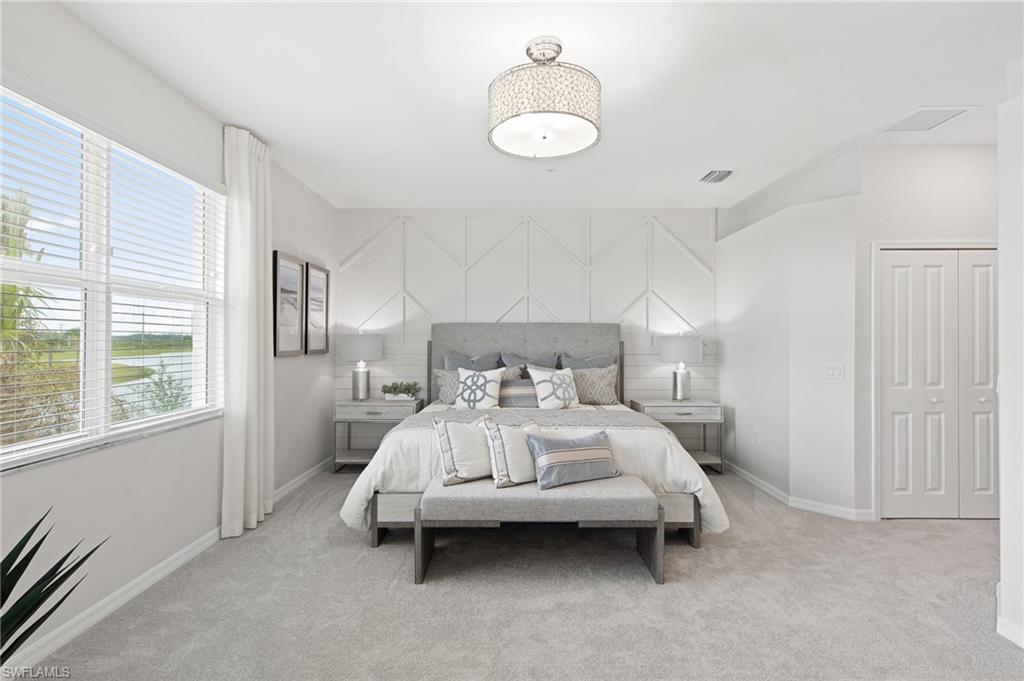 6008 Ellerston Way Avenue, Unit 1021 Immokalee, FL 34142 - Photo 32 of 50 Carpeted bedroom with baseboards and an accent wall