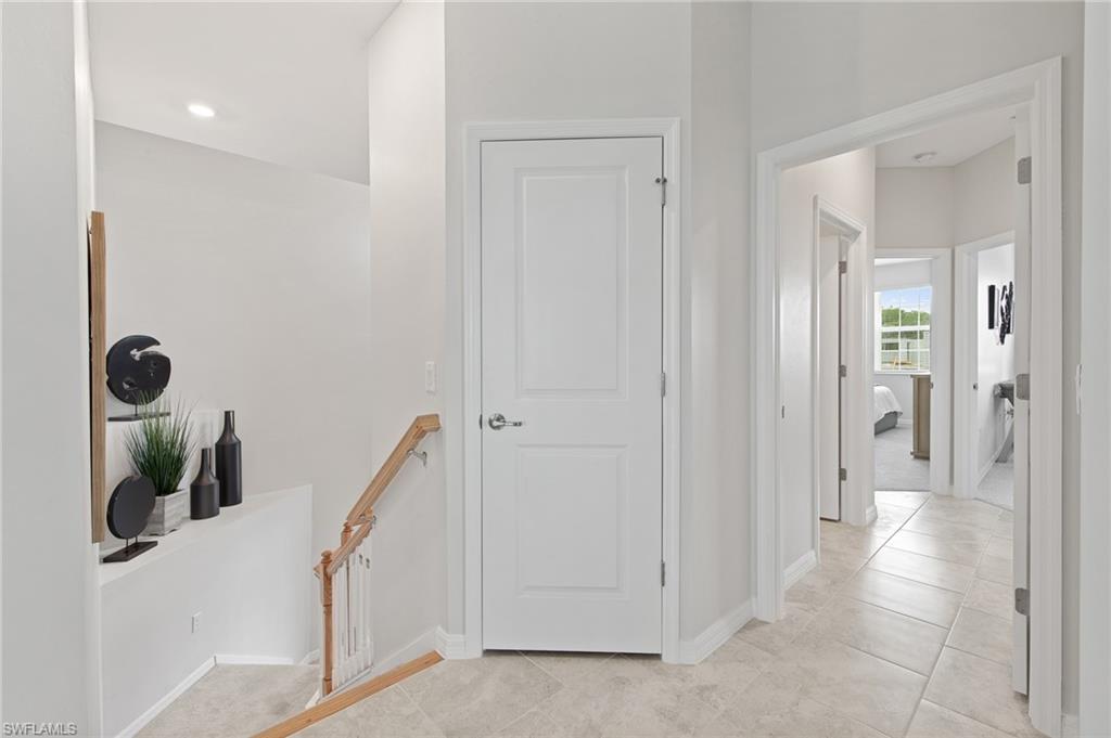 6008 Ellerston Way Avenue, Unit 1021 Immokalee, FL 34142 - Photo 36 of 50 Corridor featuring an upstairs landing, light tile patterned floors, and recessed lighting