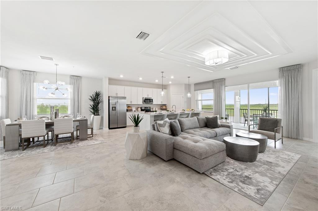 6008 Ellerston Way Avenue, Unit 1021 Immokalee, FL 34142 - Photo 4 of 50 Living area featuring plenty of natural light, a chandelier, and recessed lighting