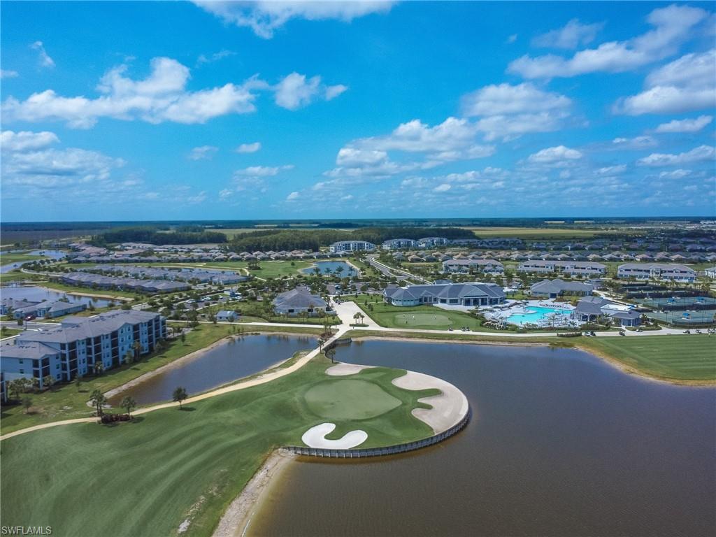 6008 Ellerston Way Avenue, Unit 1021 Immokalee, FL 34142 - Photo 41 of 50 Aerial perspective of suburban area with a large body of water and a local golf course