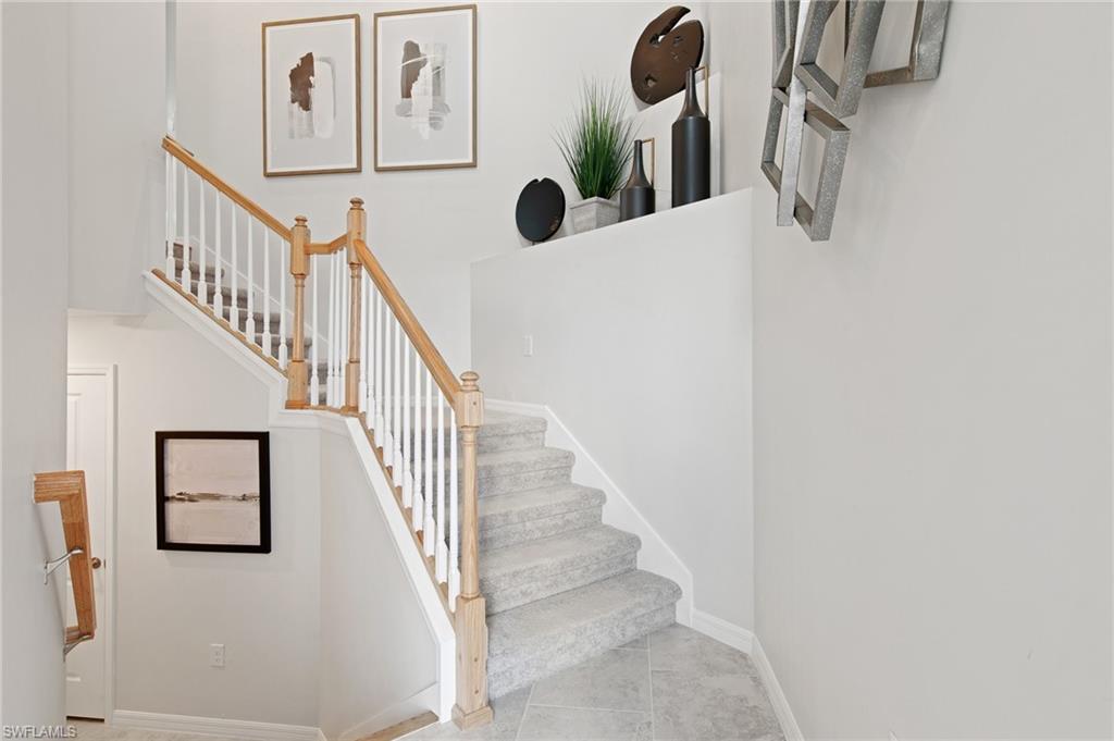 6008 Ellerston Way Avenue, Unit 1021 Immokalee, FL 34142 - Photo 9 of 50 Stairway with tile patterned floors and baseboards