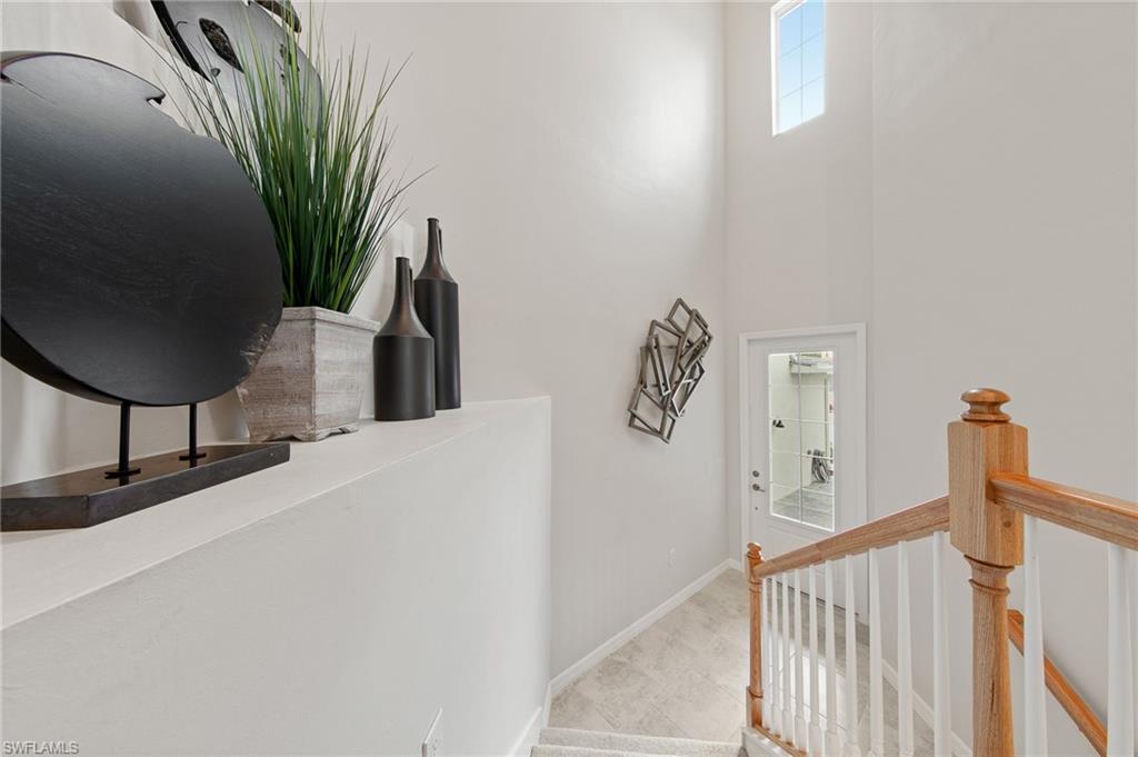 6008 Ellerston Way Avenue, Unit 1021 Immokalee, FL 34142 - Photo 10 of 50 Stairs featuring baseboards and a high ceiling