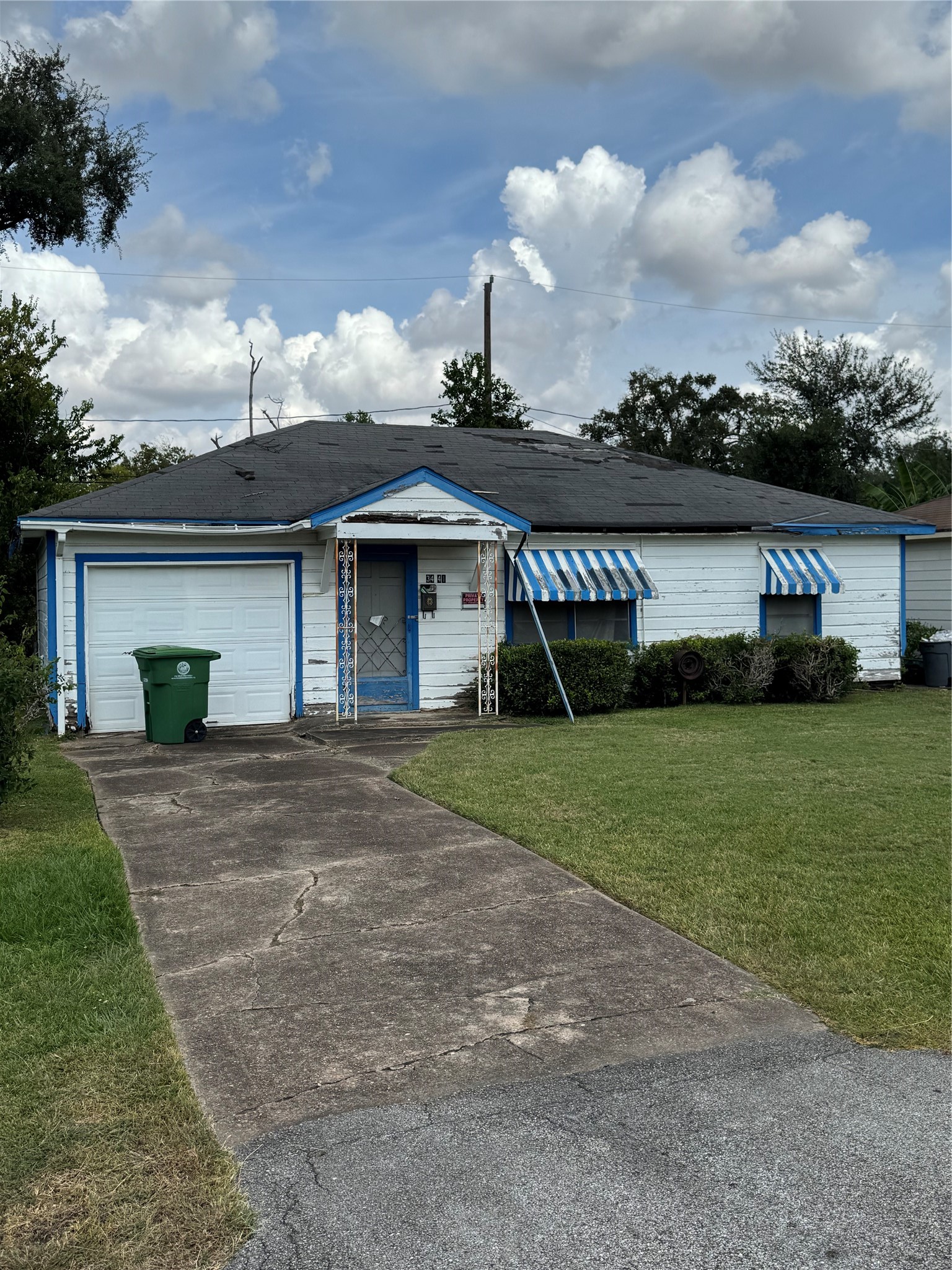 3441 Good Hope Street Houston, TX 77021 - Photo 3 of 7 a front view of a house with a garden and trees