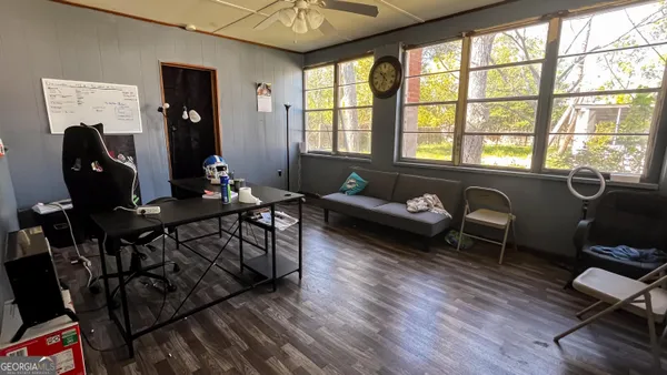 a living room with furniture and a window