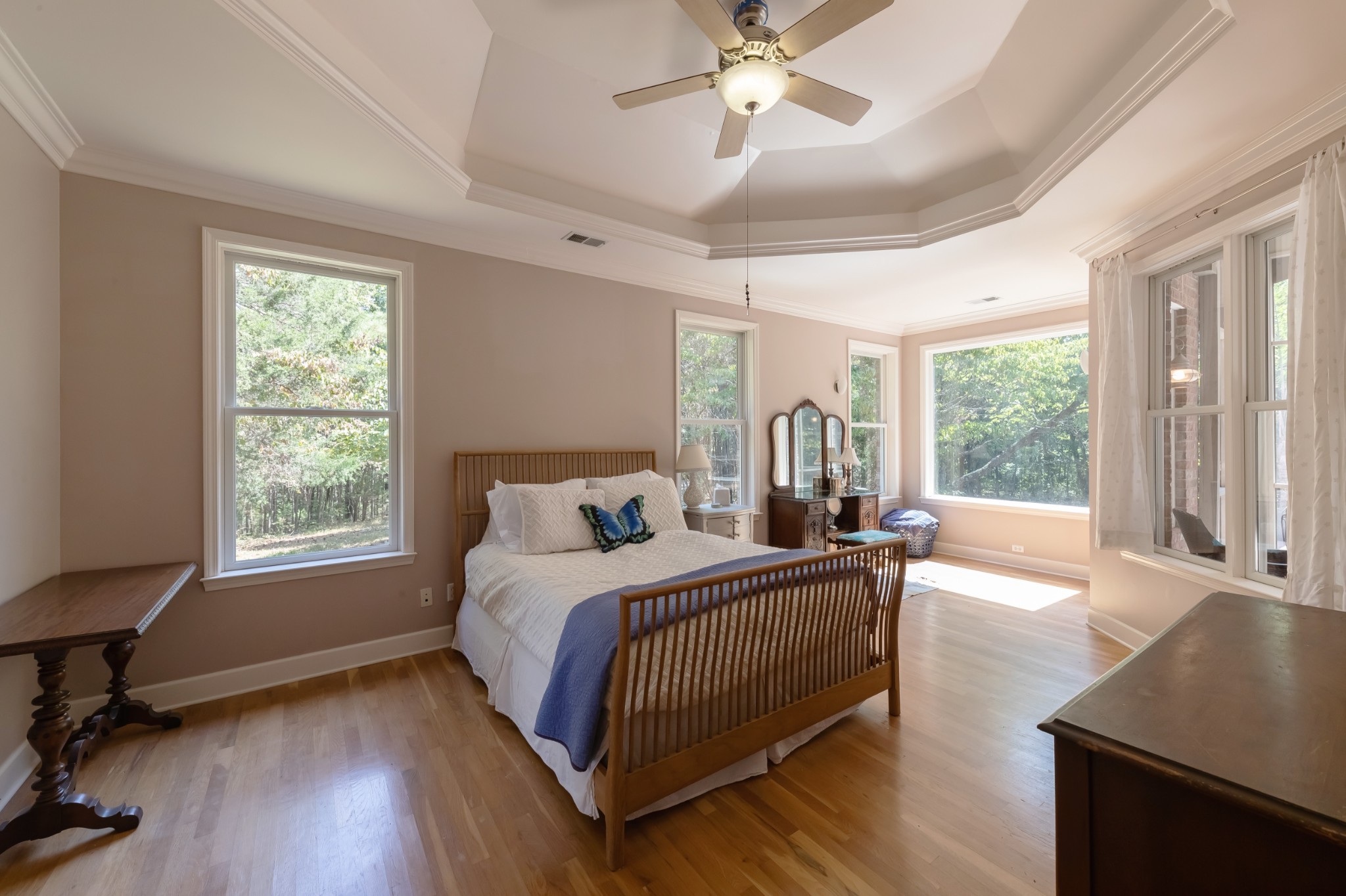 7650 Sleepy Summit Road Fairview, TN 37062 - Photo 13 of 30 a bedroom with a bed a large window and wooden floor