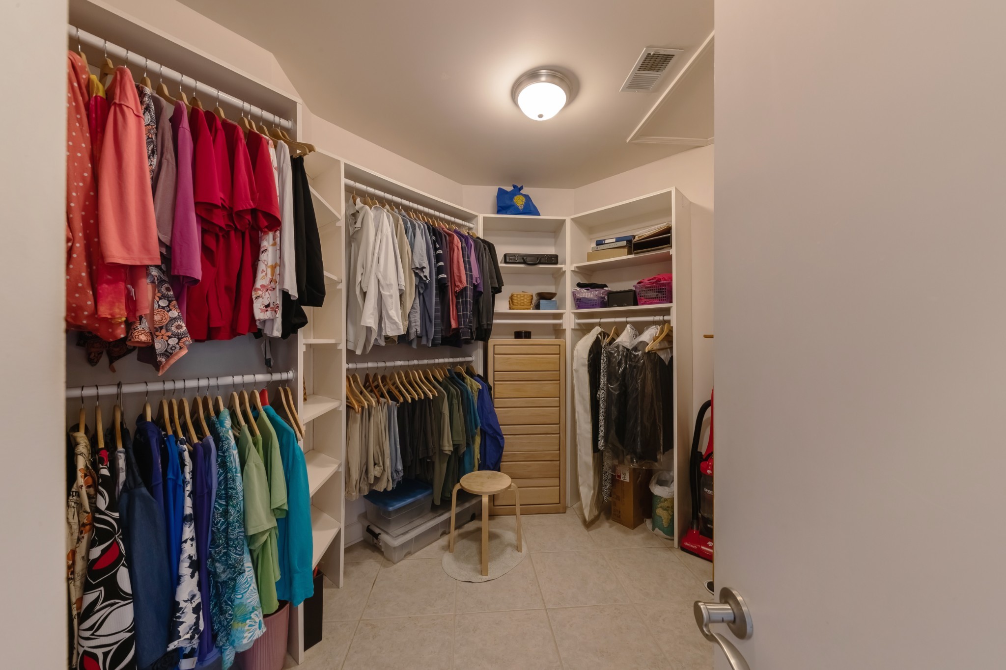 7650 Sleepy Summit Road Fairview, TN 37062 - Photo 17 of 30 a view of walk in closet with clothes and shoes
