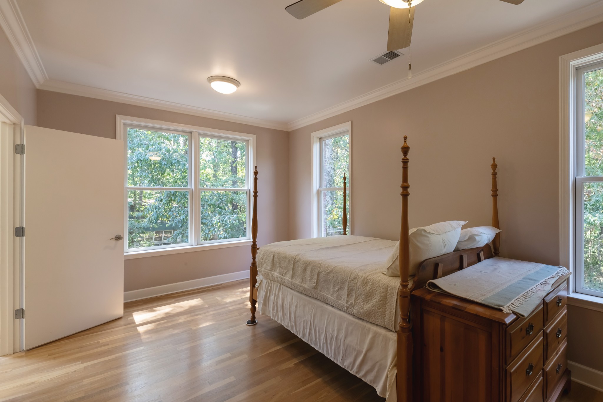7650 Sleepy Summit Road Fairview, TN 37062 - Photo 18 of 30 a bedroom with a bed and wooden floor