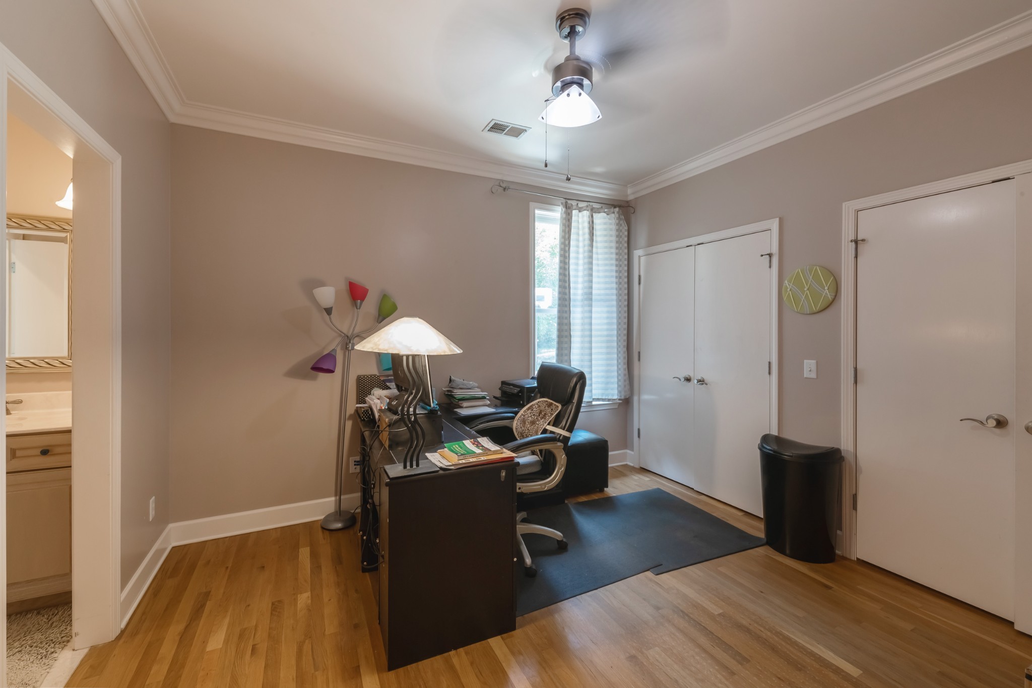 7650 Sleepy Summit Road Fairview, TN 37062 - Photo 21 of 30 a view of a workspace with furniture and a window