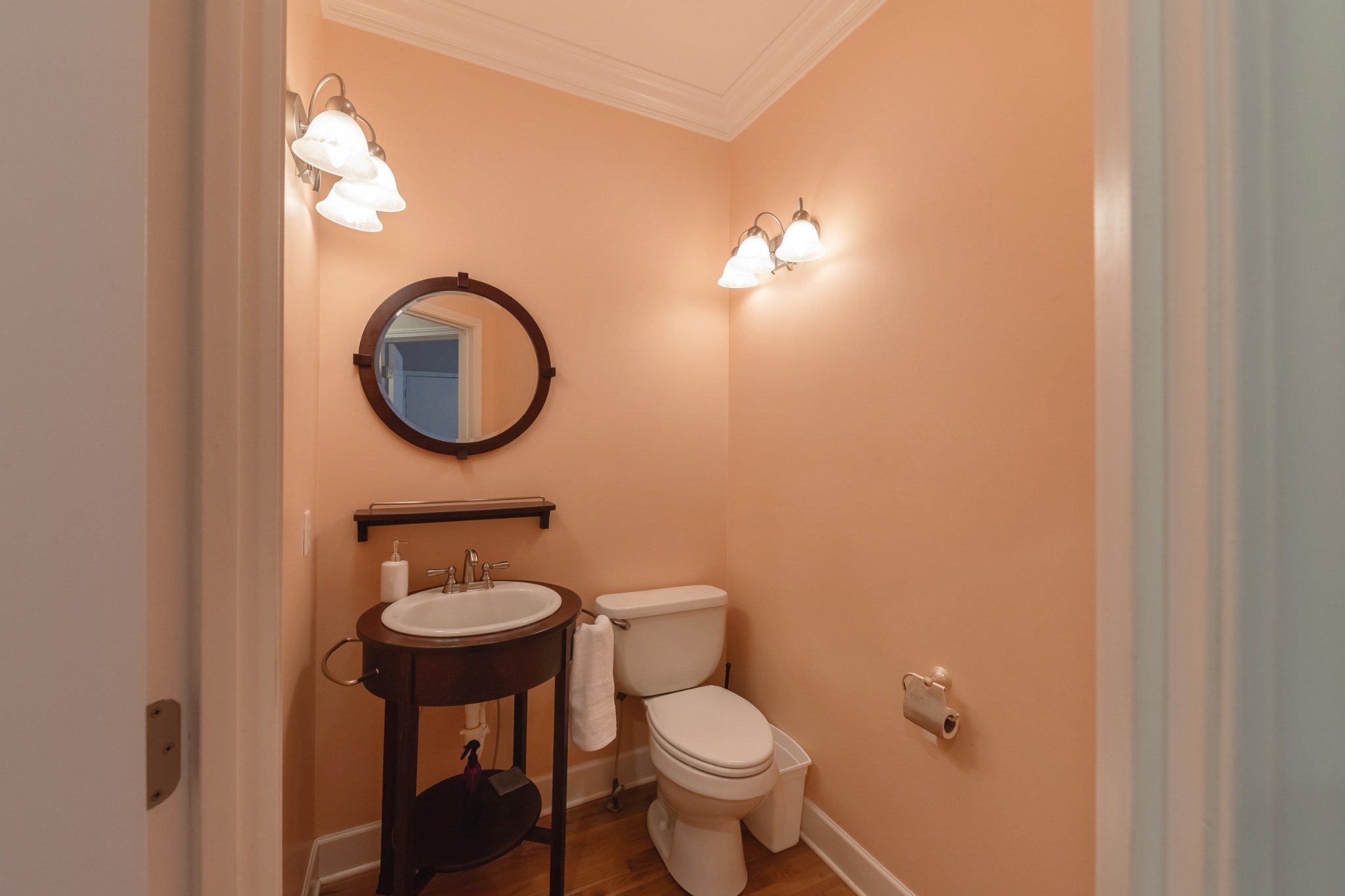 7650 Sleepy Summit Road Fairview, TN 37062 - Photo 22 of 30 a bathroom with a toilet sink and mirror