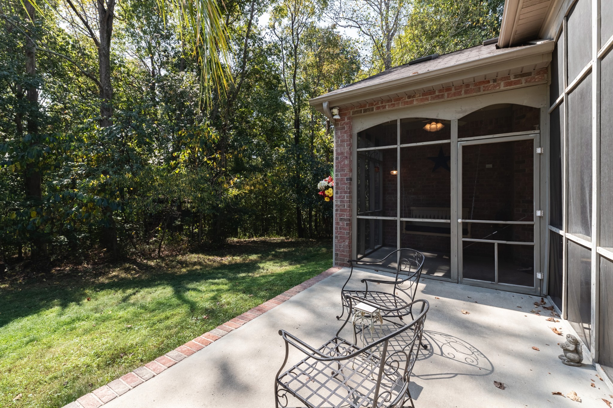 7650 Sleepy Summit Road Fairview, TN 37062 - Photo 26 of 30 a view of a chair and table in backyard of the house