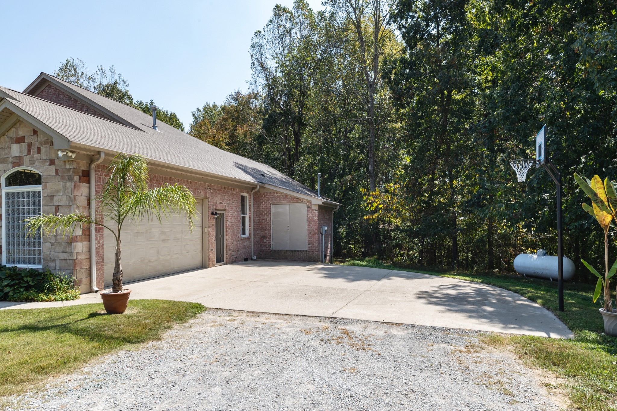 7650 Sleepy Summit Road Fairview, TN 37062 - Photo 29 of 30 a backyard of a house with plants and trees