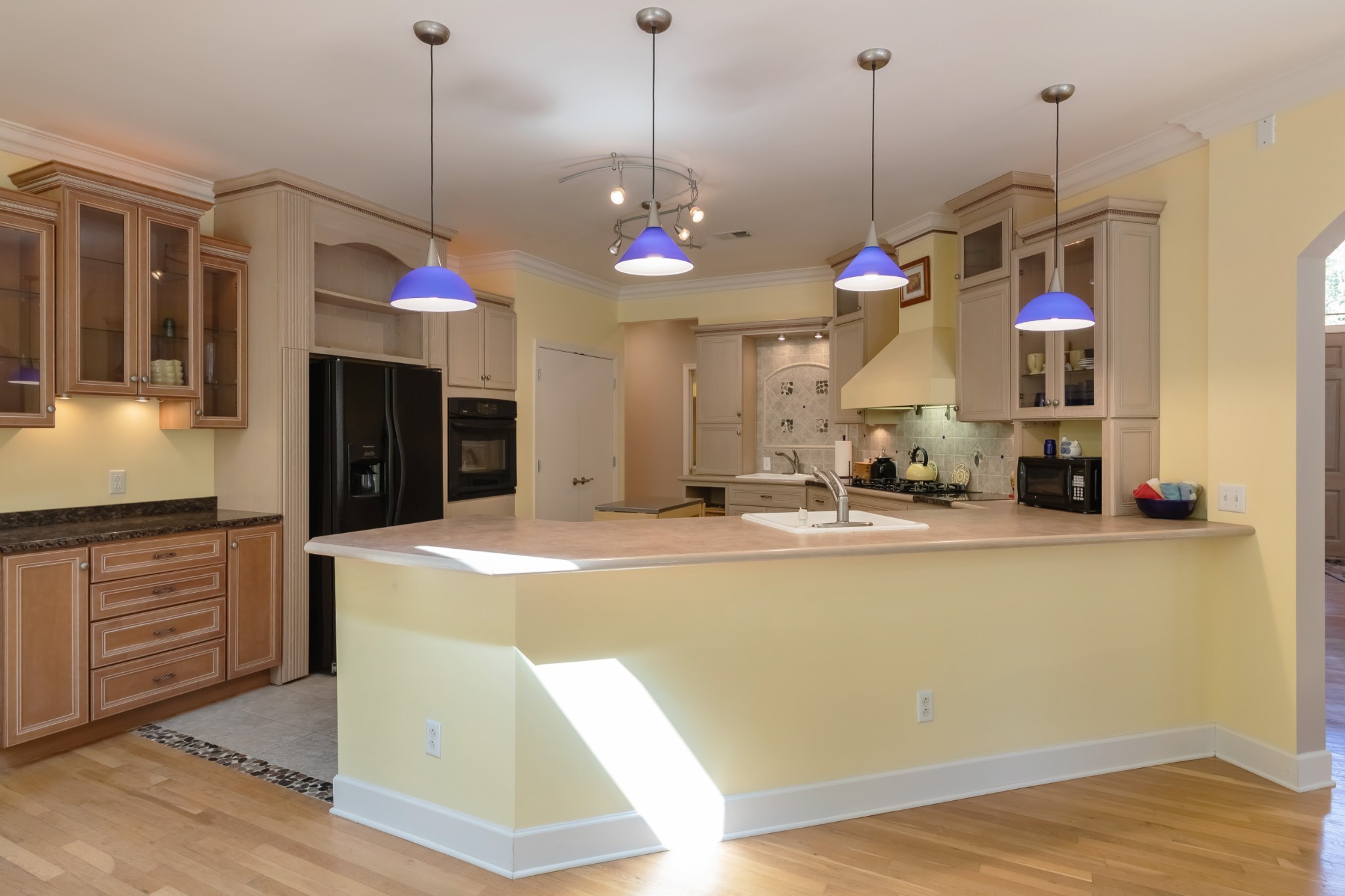 7650 Sleepy Summit Road Fairview, TN 37062 - Photo 9 of 30 a view of a room with kitchen island stainless steel appliances sink and cabinets