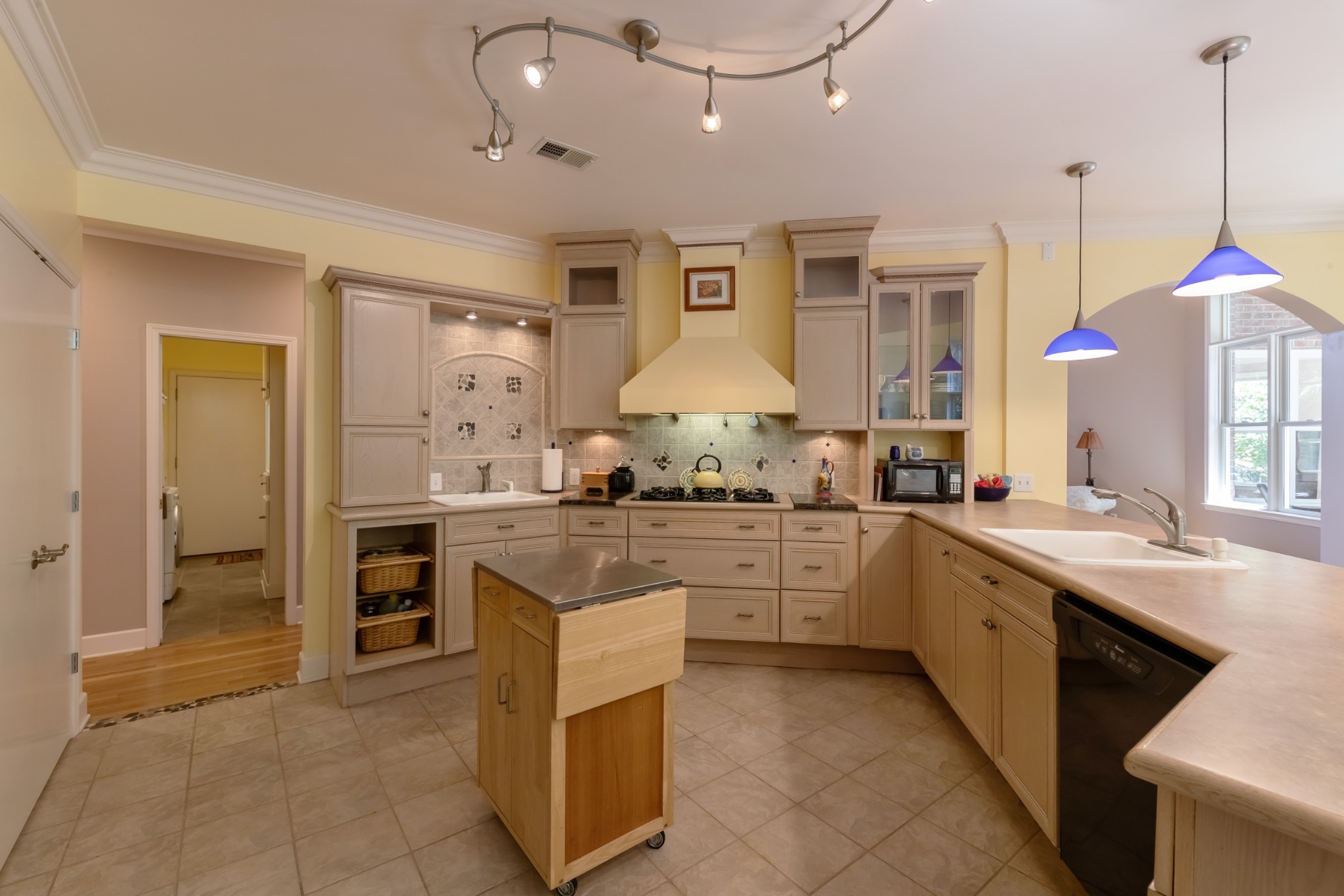 7650 Sleepy Summit Road Fairview, TN 37062 - Photo 10 of 30 a kitchen with granite countertop a sink stove and refrigerator