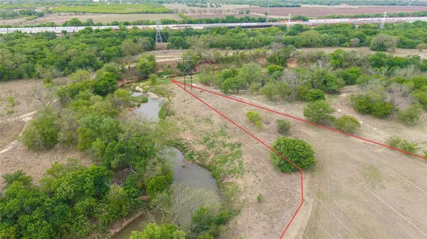 a view of a yard with a lake view