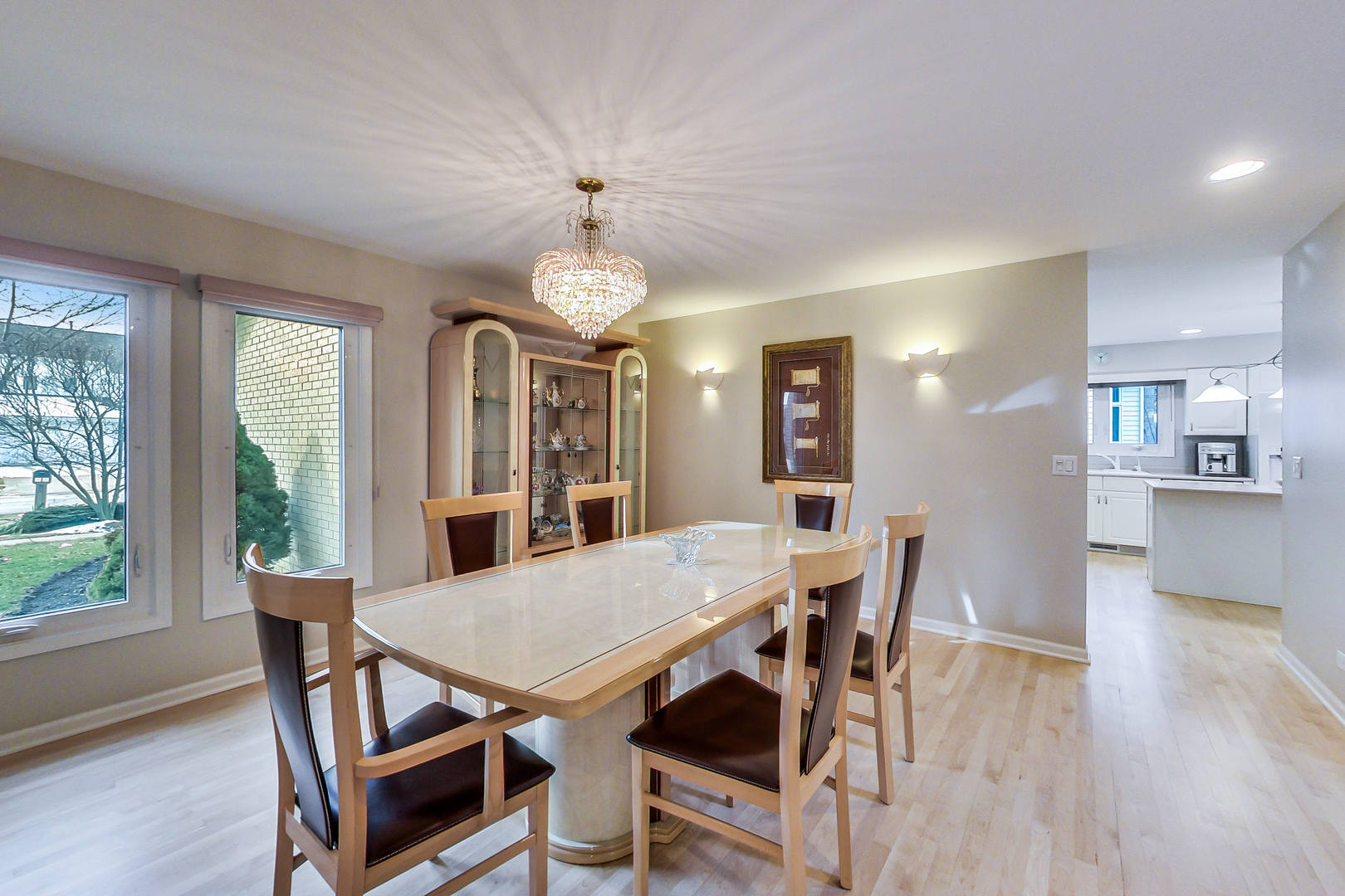 790 Edgemere Road Buffalo Grove, IL 60089 - Photo 11 of 42 a view of a dining room with furniture window and wooden floor