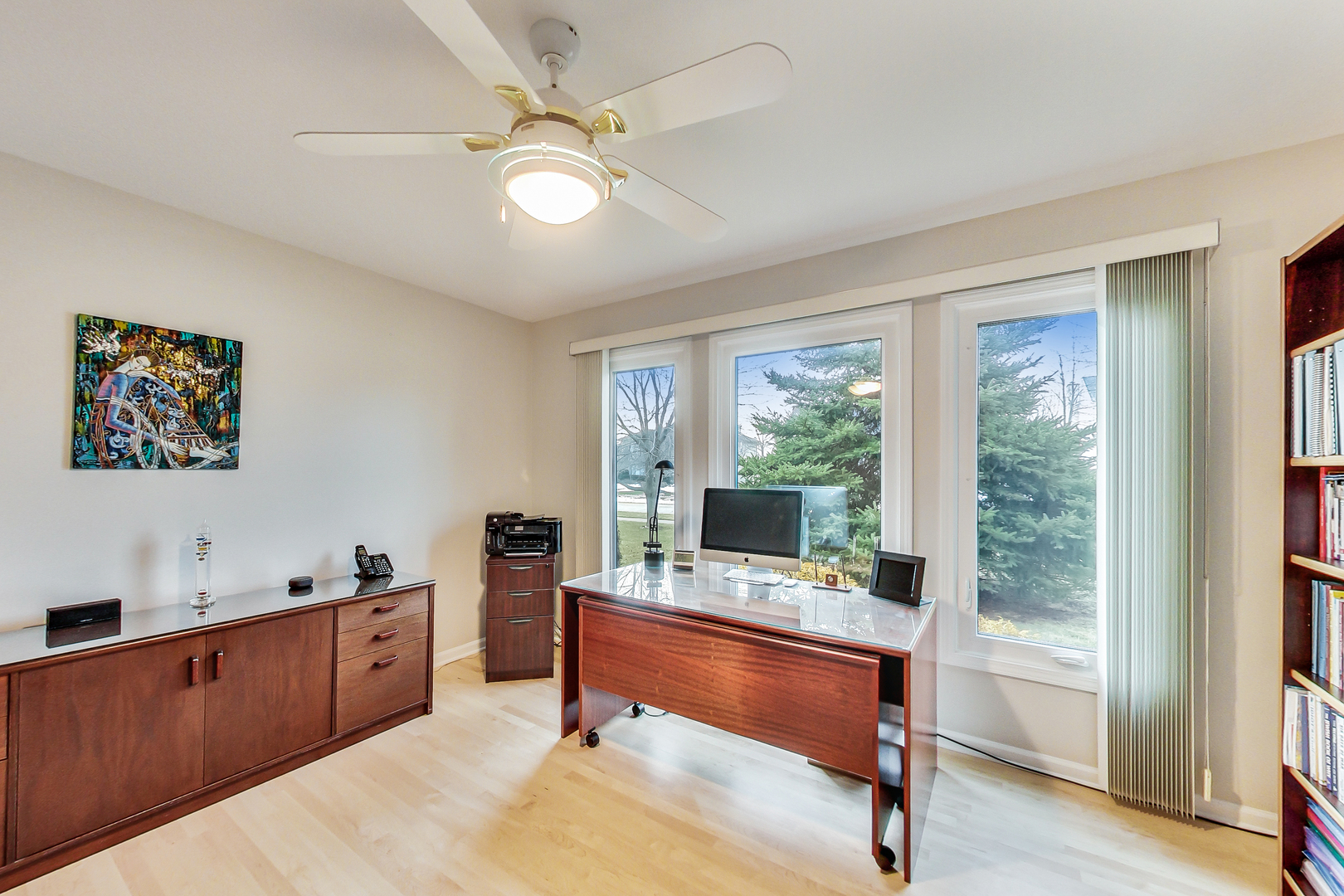 790 Edgemere Road Buffalo Grove, IL 60089 - Photo 15 of 42 a workspace with wooden floor and sliding door