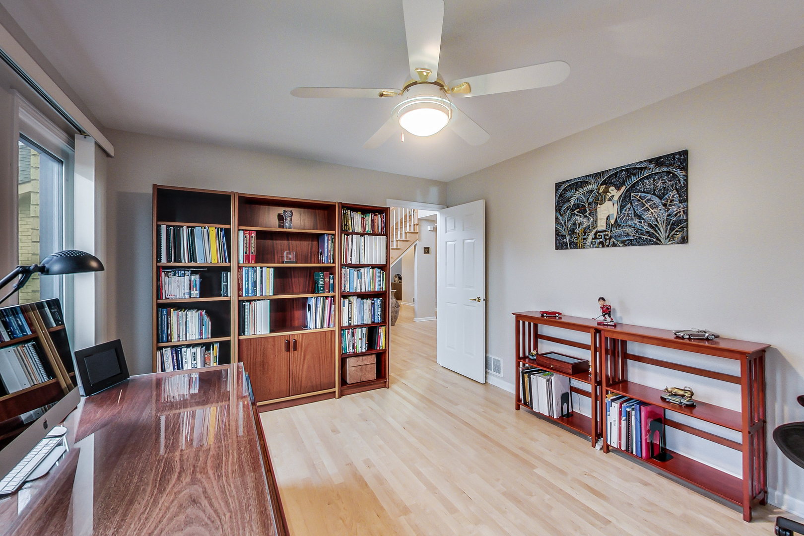 790 Edgemere Road Buffalo Grove, IL 60089 - Photo 16 of 42 a view of a workspace with furniture and wooden floor