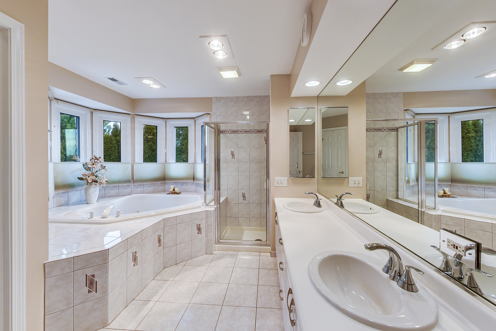790 Edgemere Road Buffalo Grove, IL 60089 - Photo 22 of 42 a large bathroom with a granite countertop double vanity sink a mirror and a shower