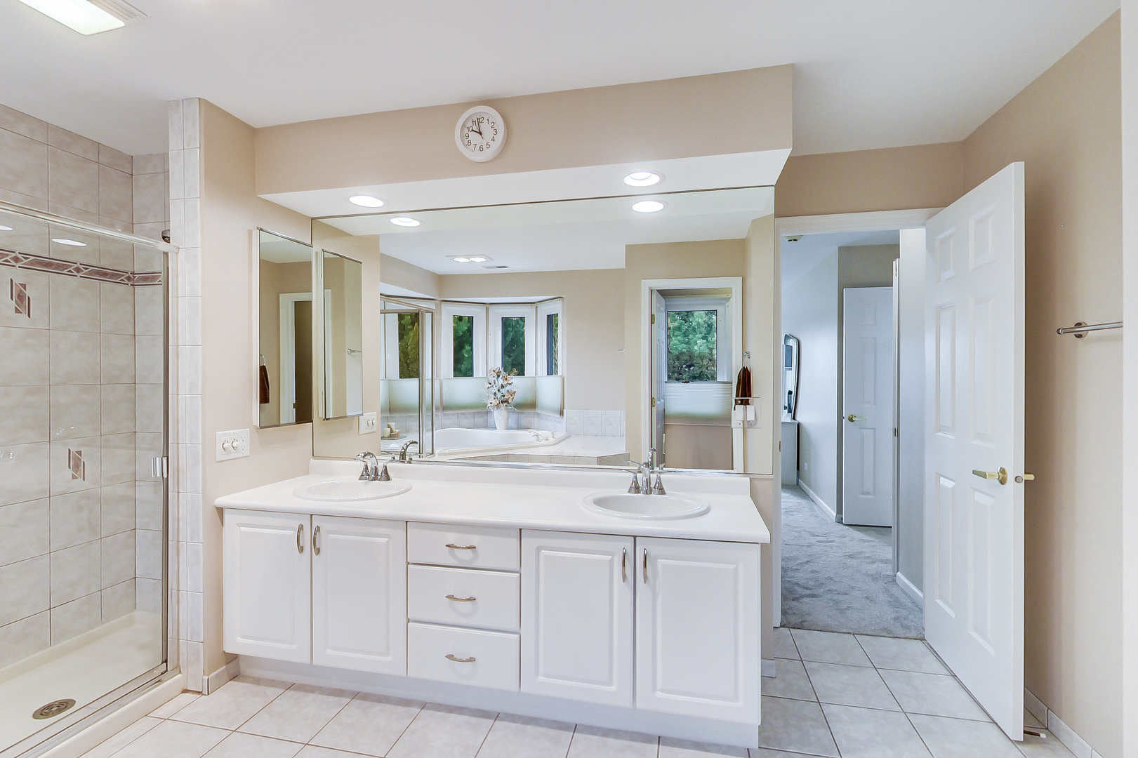 790 Edgemere Road Buffalo Grove, IL 60089 - Photo 23 of 42 a spacious bathroom with a double vanity sink mirror and shower