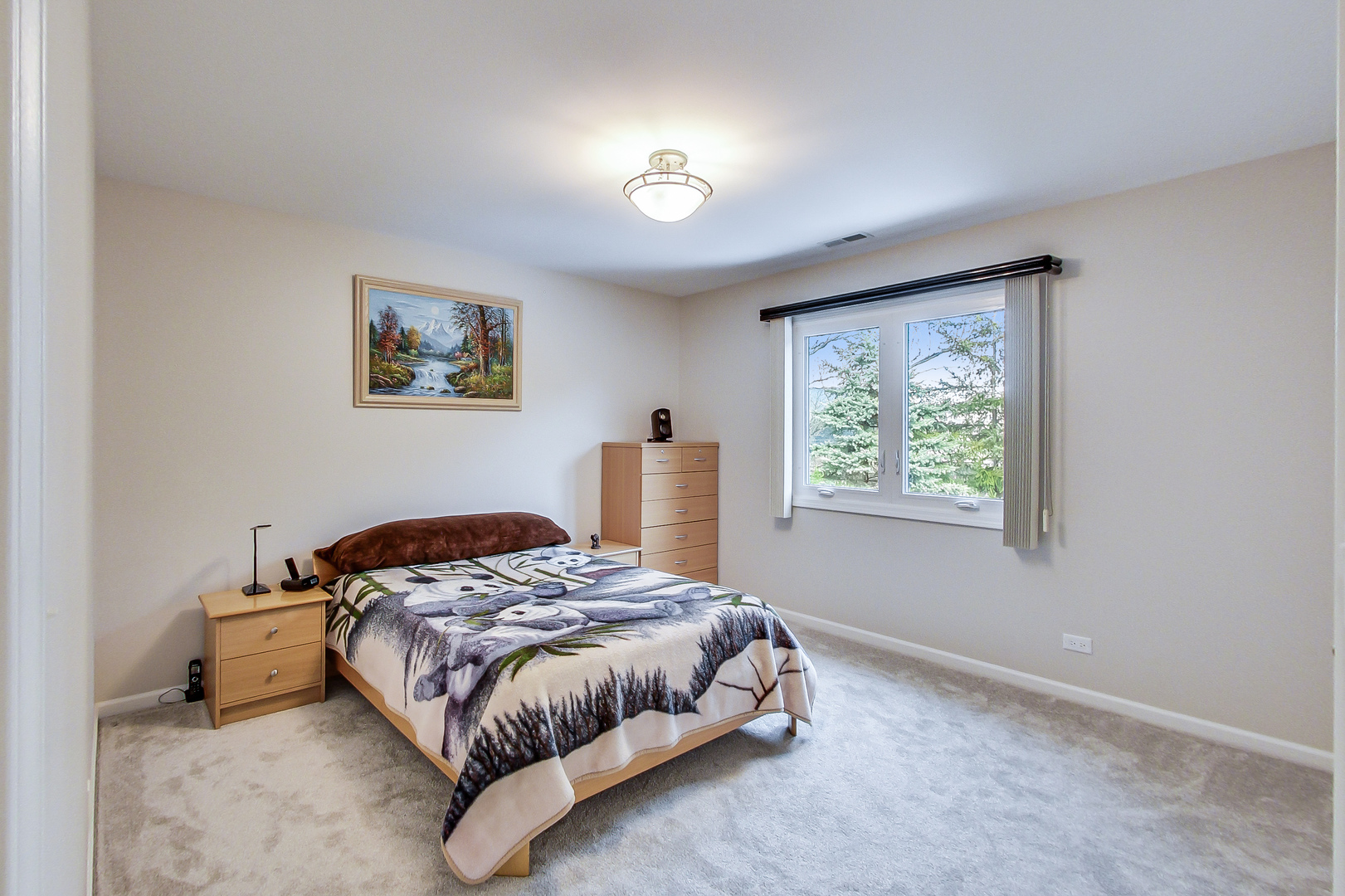 790 Edgemere Road Buffalo Grove, IL 60089 - Photo 26 of 42 a bedroom with a bed and a window