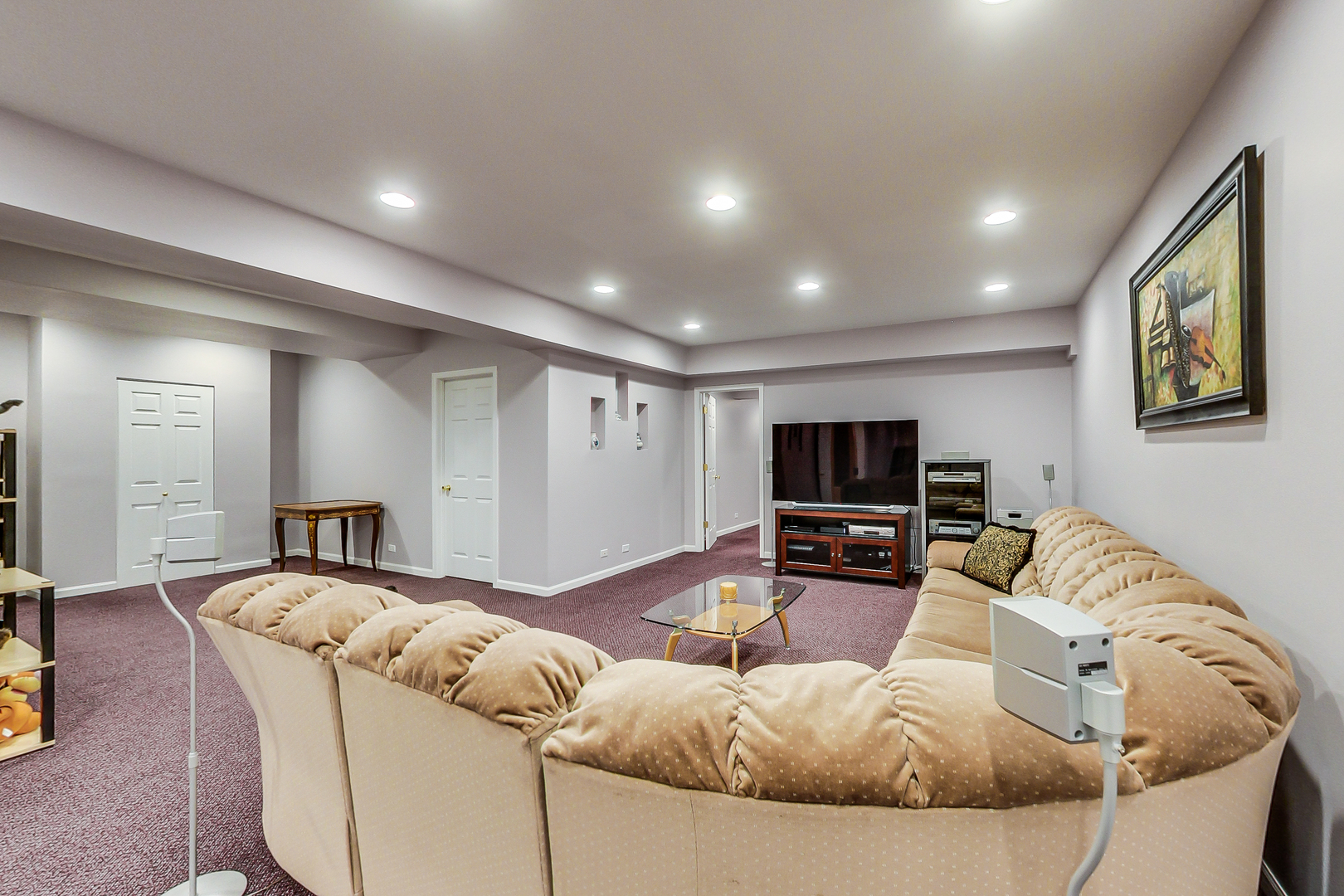 790 Edgemere Road Buffalo Grove, IL 60089 - Photo 29 of 42 a living room with furniture and a flat screen tv