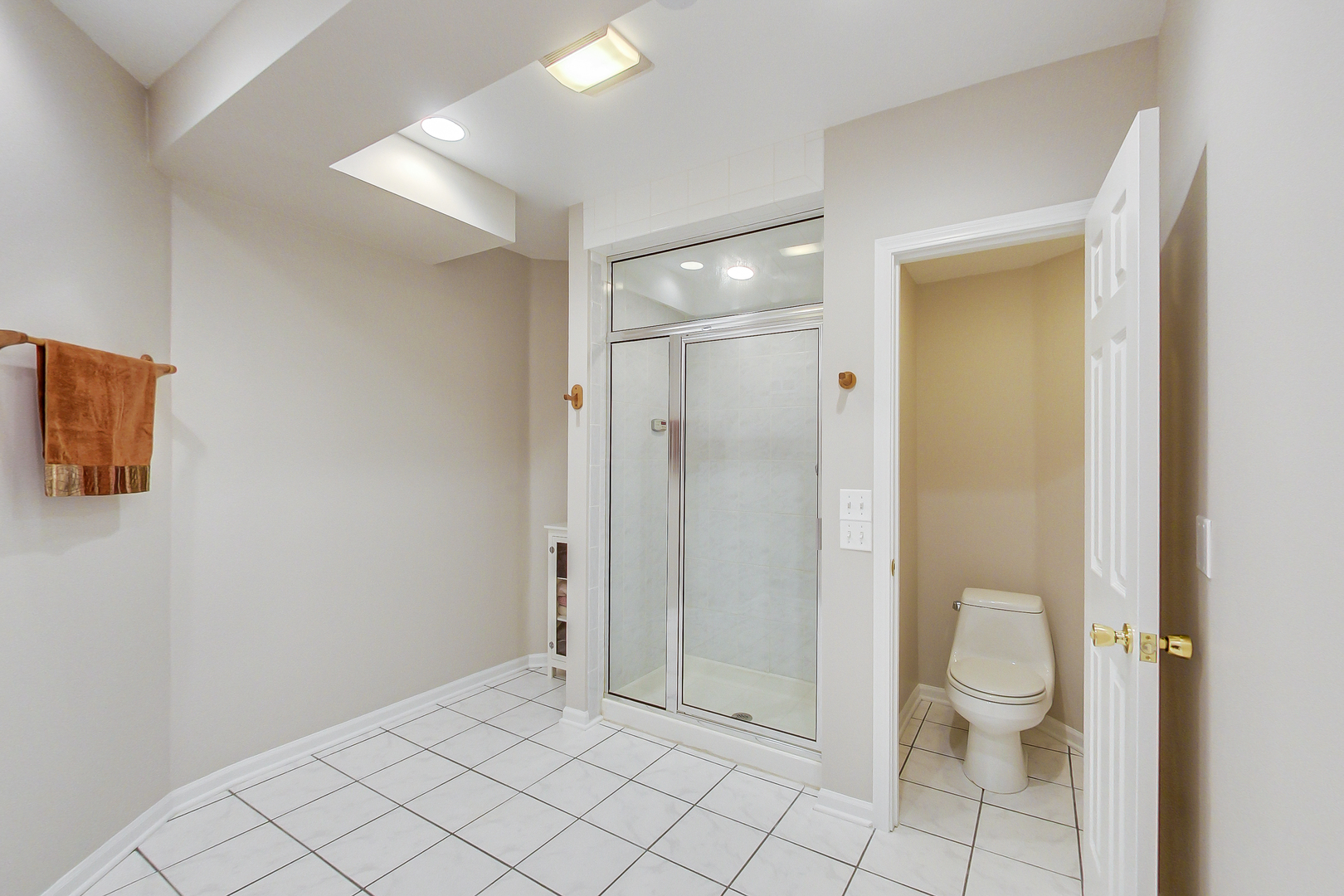 790 Edgemere Road Buffalo Grove, IL 60089 - Photo 35 of 42 a bathroom with a granite countertop toilet and a shower