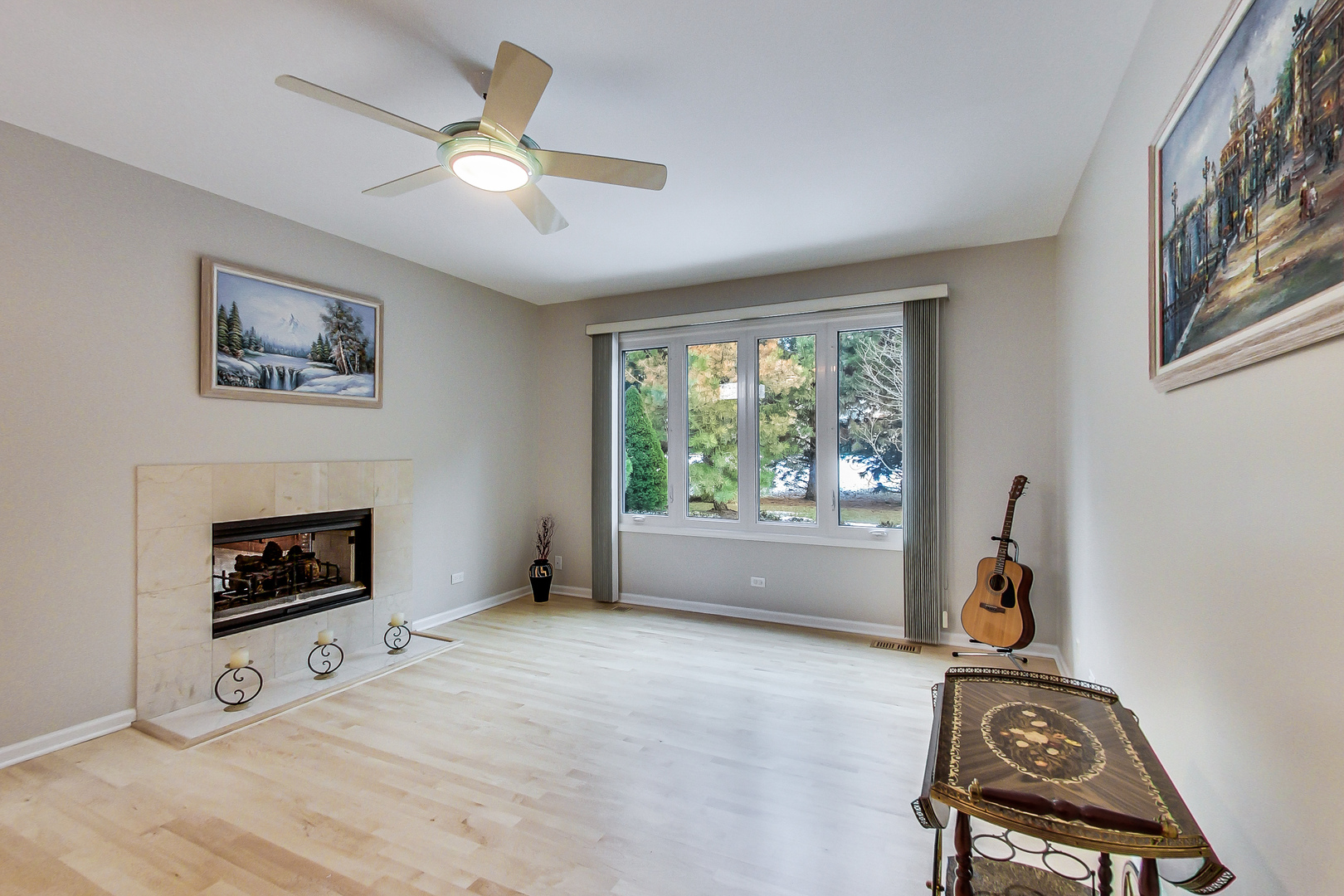 790 Edgemere Road Buffalo Grove, IL 60089 - Photo 10 of 42 a living room with furniture and a fireplace