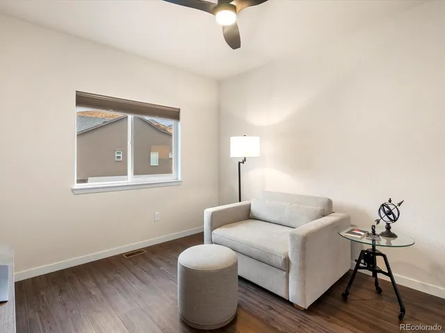 a room with furniture and wooden floor