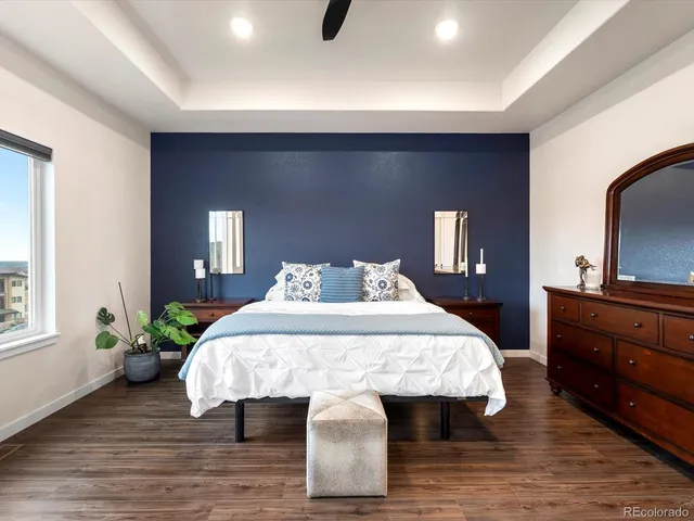 a bed room with a bed and a dresser