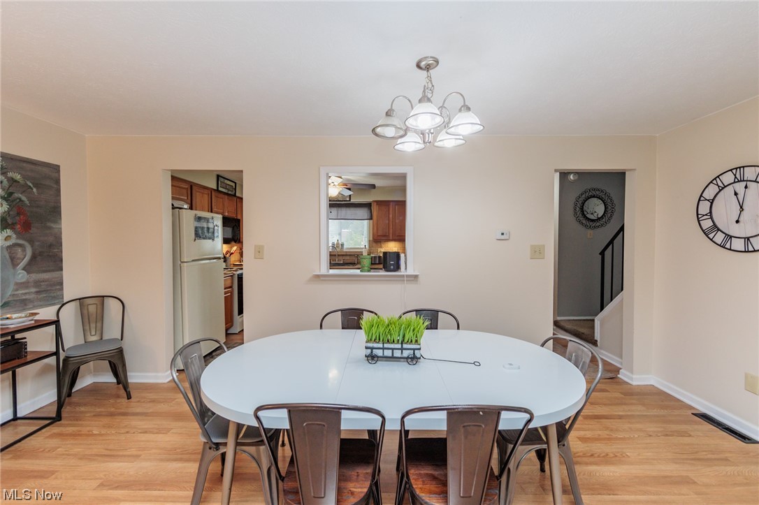 6476 State Road, Unit H8 Cleveland, OH 44134 - Photo 15 of 35 Dining area featuring light hardwood floors