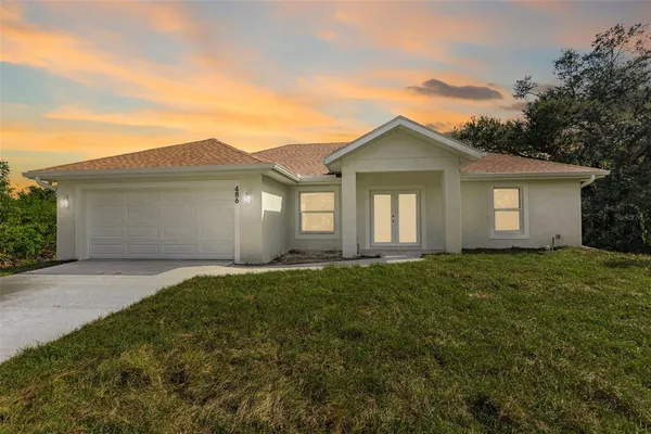 front view of a house with a yard