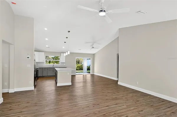 a view of kitchen with furniture and wooden floor