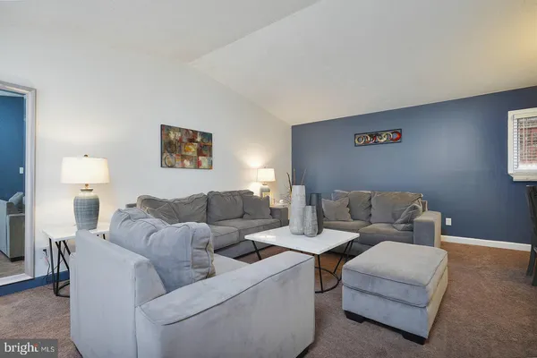 a living room with furniture and a couch