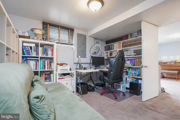 a view of a workspace with furniture and toys