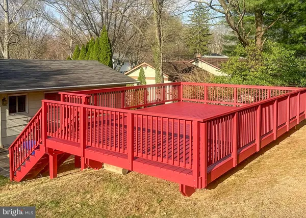 a balcony with trees in front of it