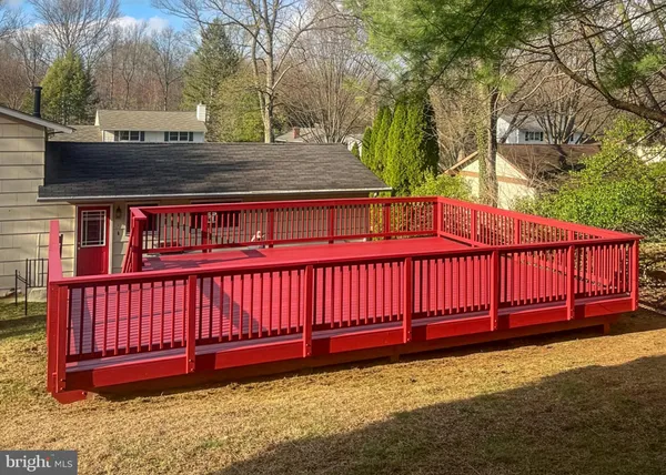a view of a yard with a wooden fence