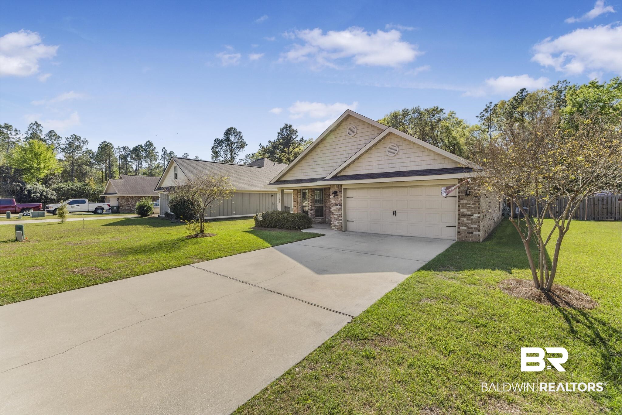 22043 Garland Loop Silverhill, AL 36576 - Photo 5 of 41 View of front of house with driveway, an attached garage, and brick siding