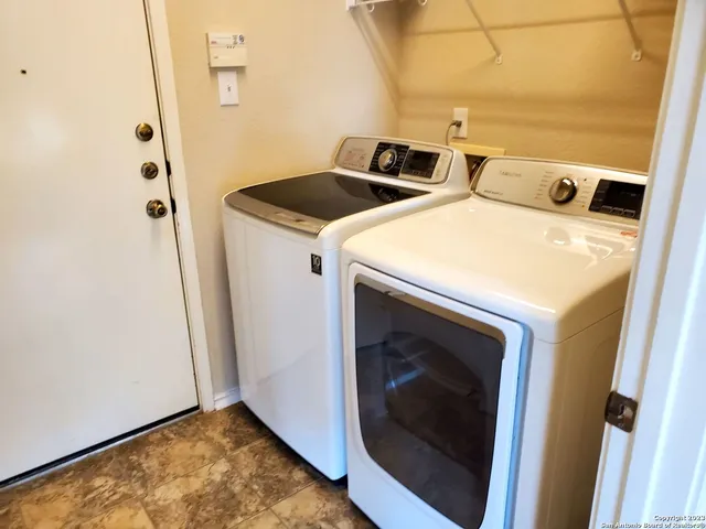 a utility room with dryer and washer