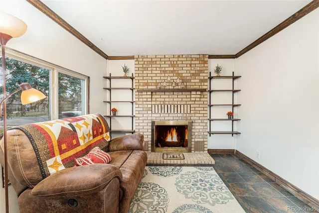 a living room with a couch and a fireplace