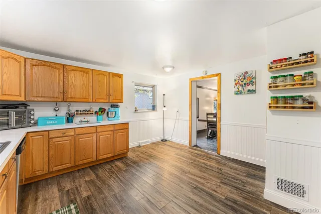 a kitchen with stainless steel appliances granite countertop a refrigerator sink and cabinets