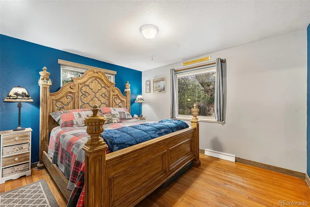 a bed room with a bed and a window