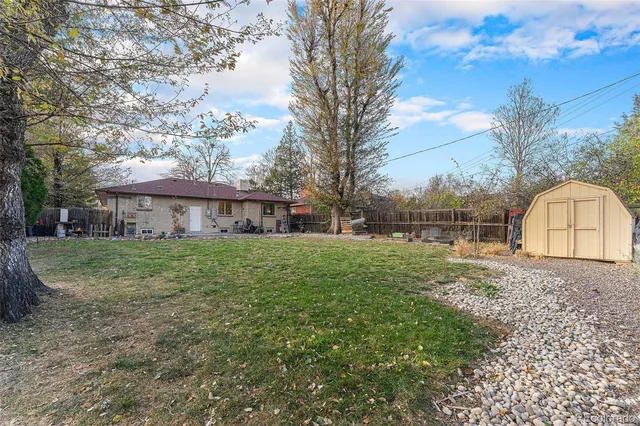 a view of a house with yard and a garden