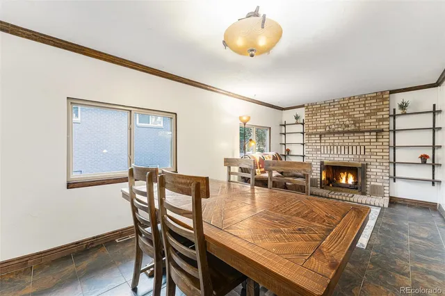 a dining room with furniture and fireplace