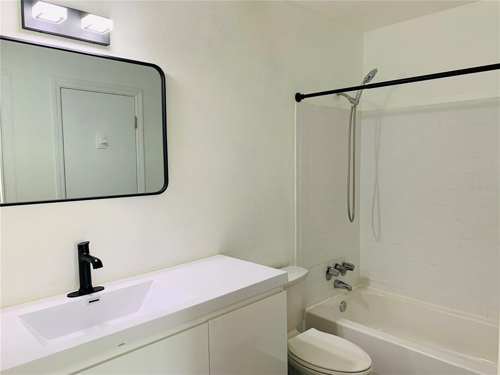 435 Wymore Road, Unit 207 Altamonte Springs, FL 32714 - Photo 11 of 16 a bathroom with a sink toilet and tub