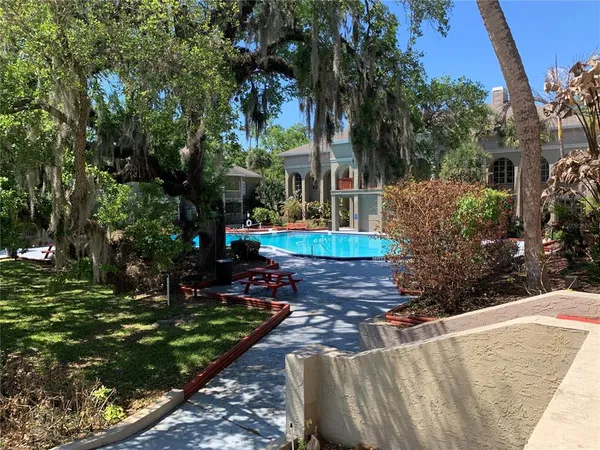 a view of swimming pool from a lounge chair