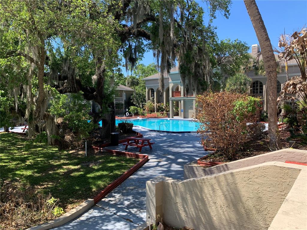435 Wymore Road, Unit 207 Altamonte Springs, FL 32714 - Photo 13 of 16 a front view of a house with garden
