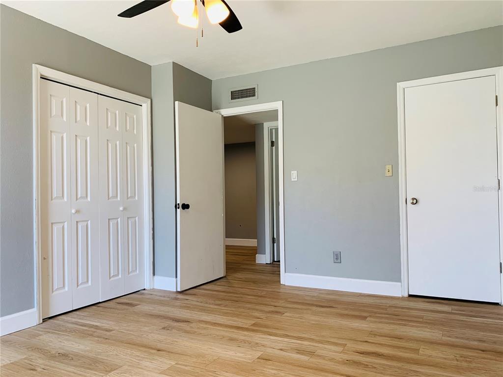 435 Wymore Road, Unit 207 Altamonte Springs, FL 32714 - Photo 8 of 16 a view of an empty room with wooden floor