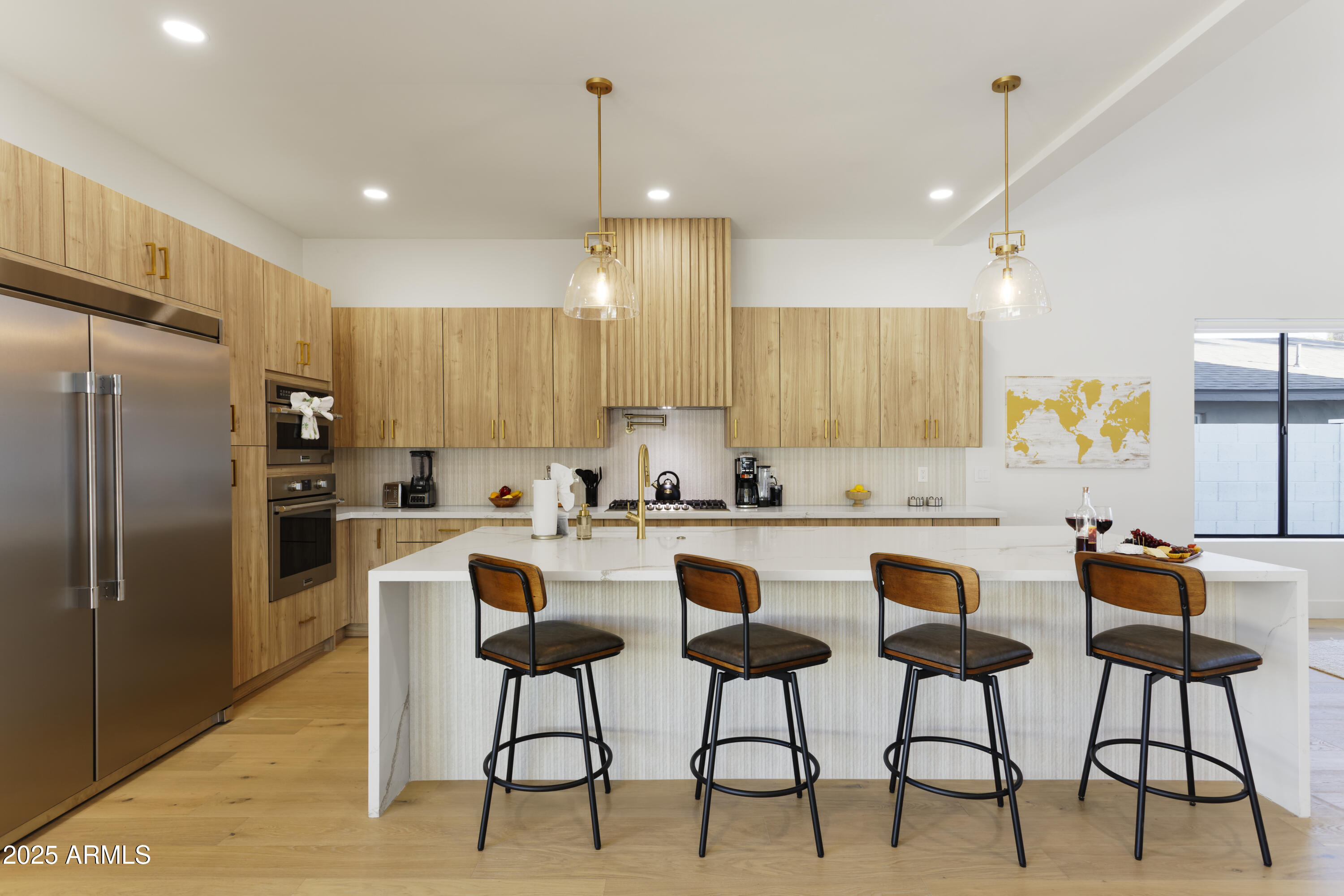 7520 East Highland Avenue Scottsdale, AZ 85251 - Photo 12 of 52 a kitchen with stainless steel appliances granite countertop a stove a sink a refrigerator a dining table and chairs